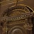 An ornate architectural detail featuring intricate gold leaf designs and classical elements such as columns and arches. The decorations include floral motifs and symmetrical patterns, creating an elaborate and luxurious aesthetic.