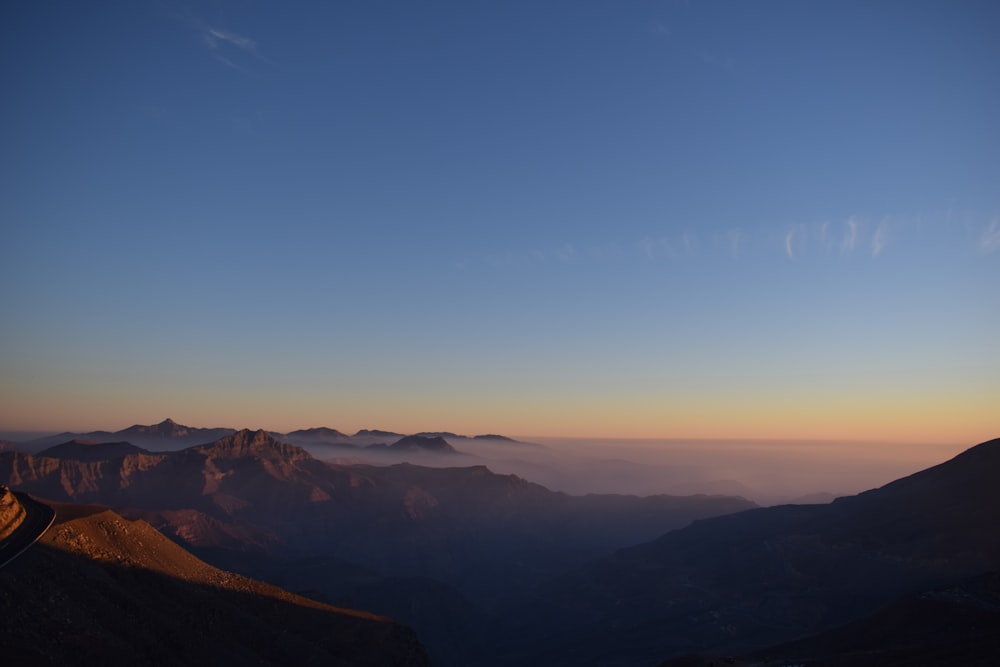 mountains under blue sky during daytime