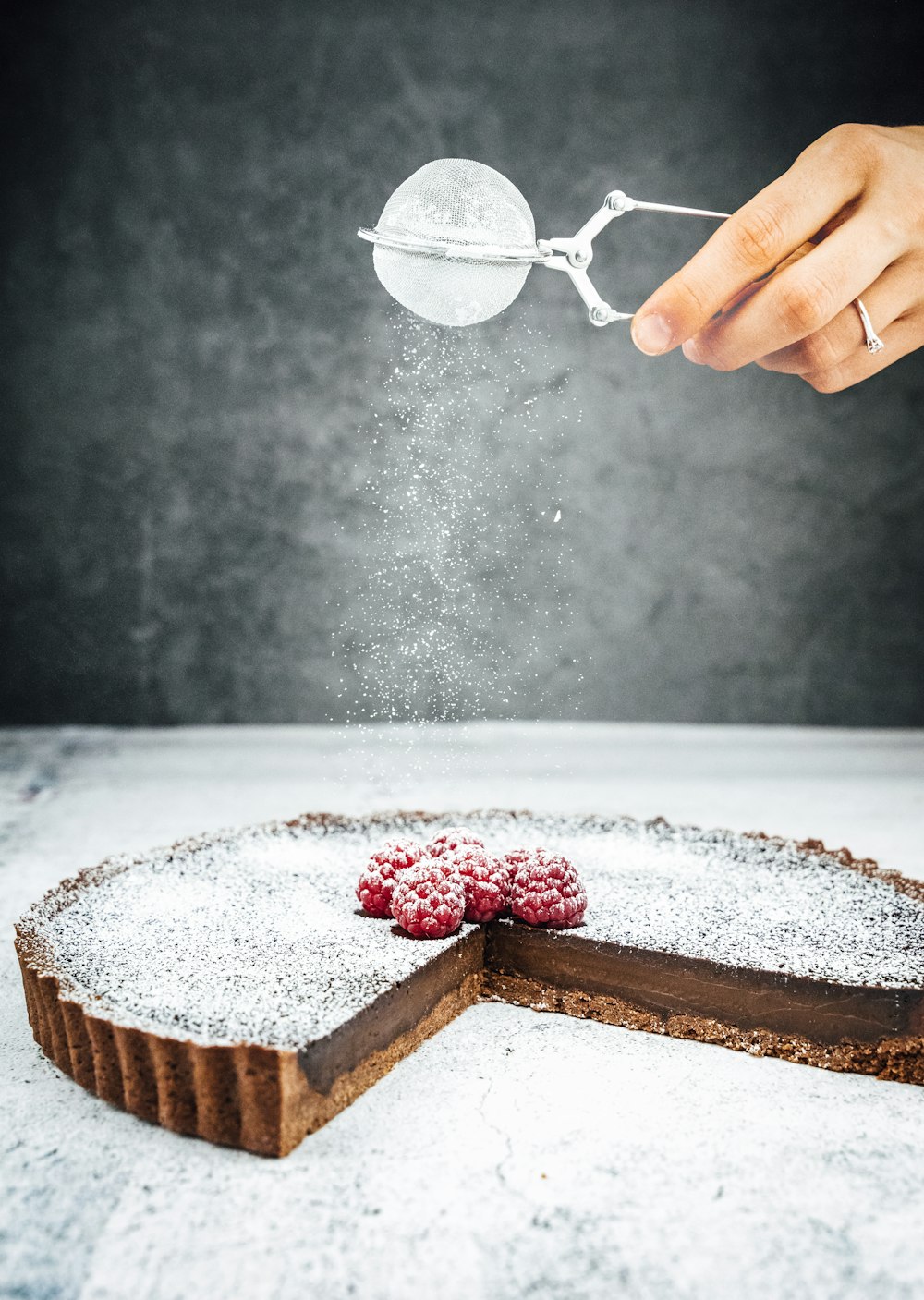 person holding stainless steel spoon