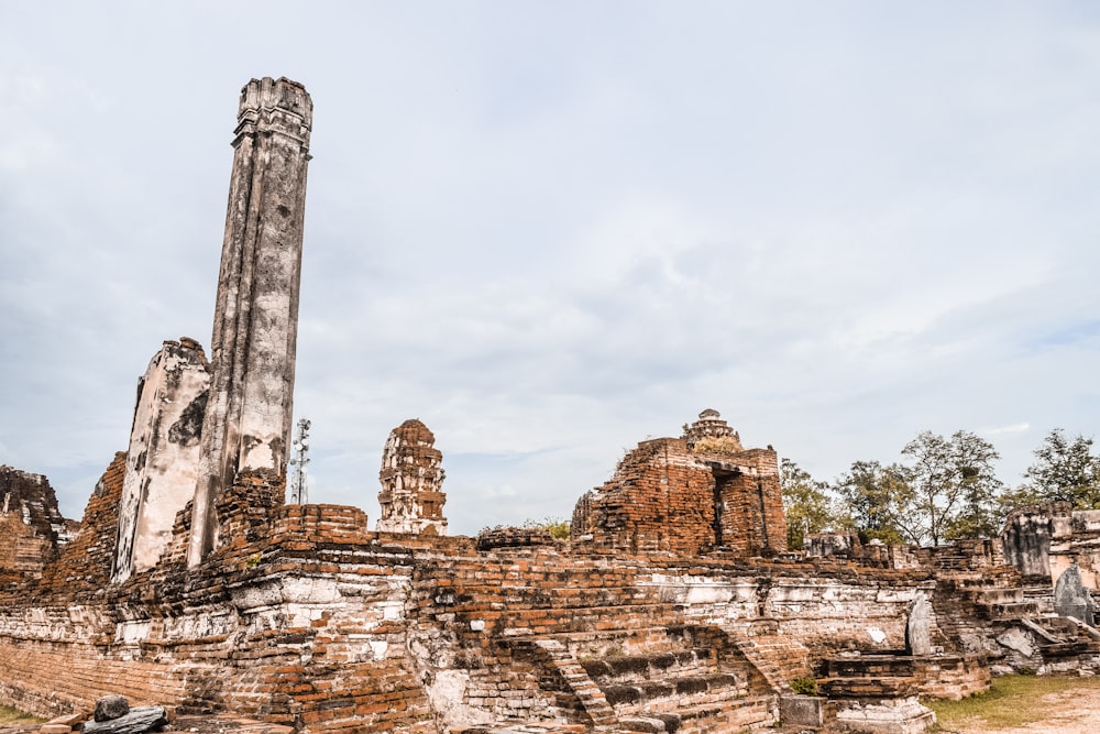 brown concrete ruins under white sky during daytime