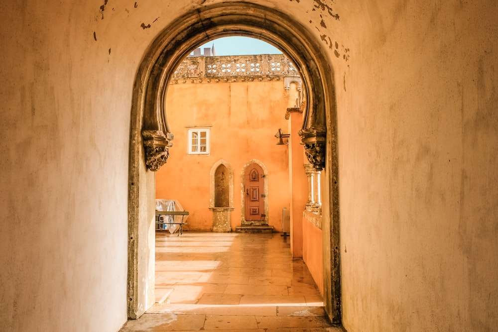 brown and white hallway with brown wooden doors