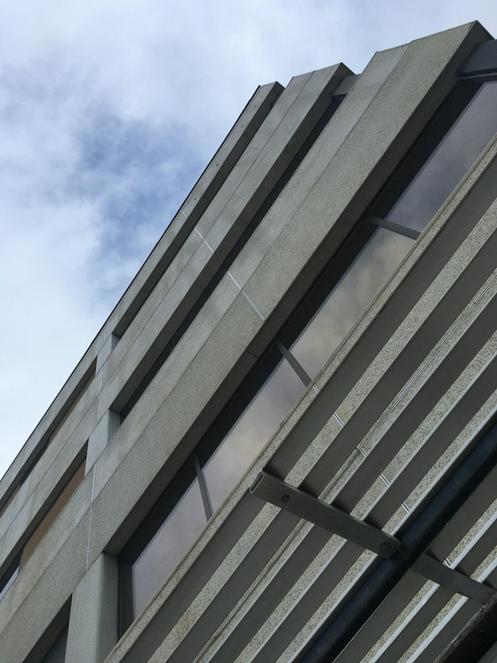 gray concrete building under blue sky during daytime