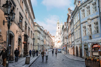 people walking on street between buildings during daytime