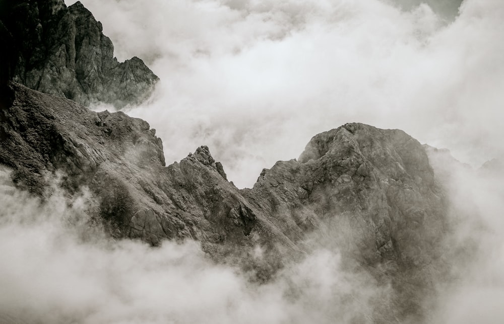 gray and black mountain covered with clouds