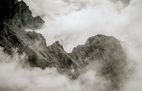 gray and black mountain covered with clouds in Dachstein glacier Austria