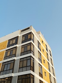 white concrete building under blue sky during daytime