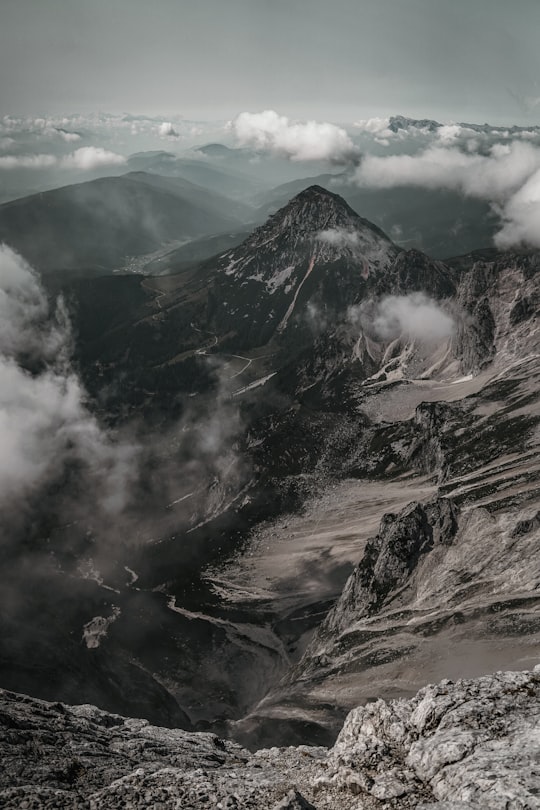 black and white mountains under white clouds during daytime in Dachstein glacier Austria