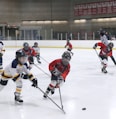 men playing ice hockey on ice stadium