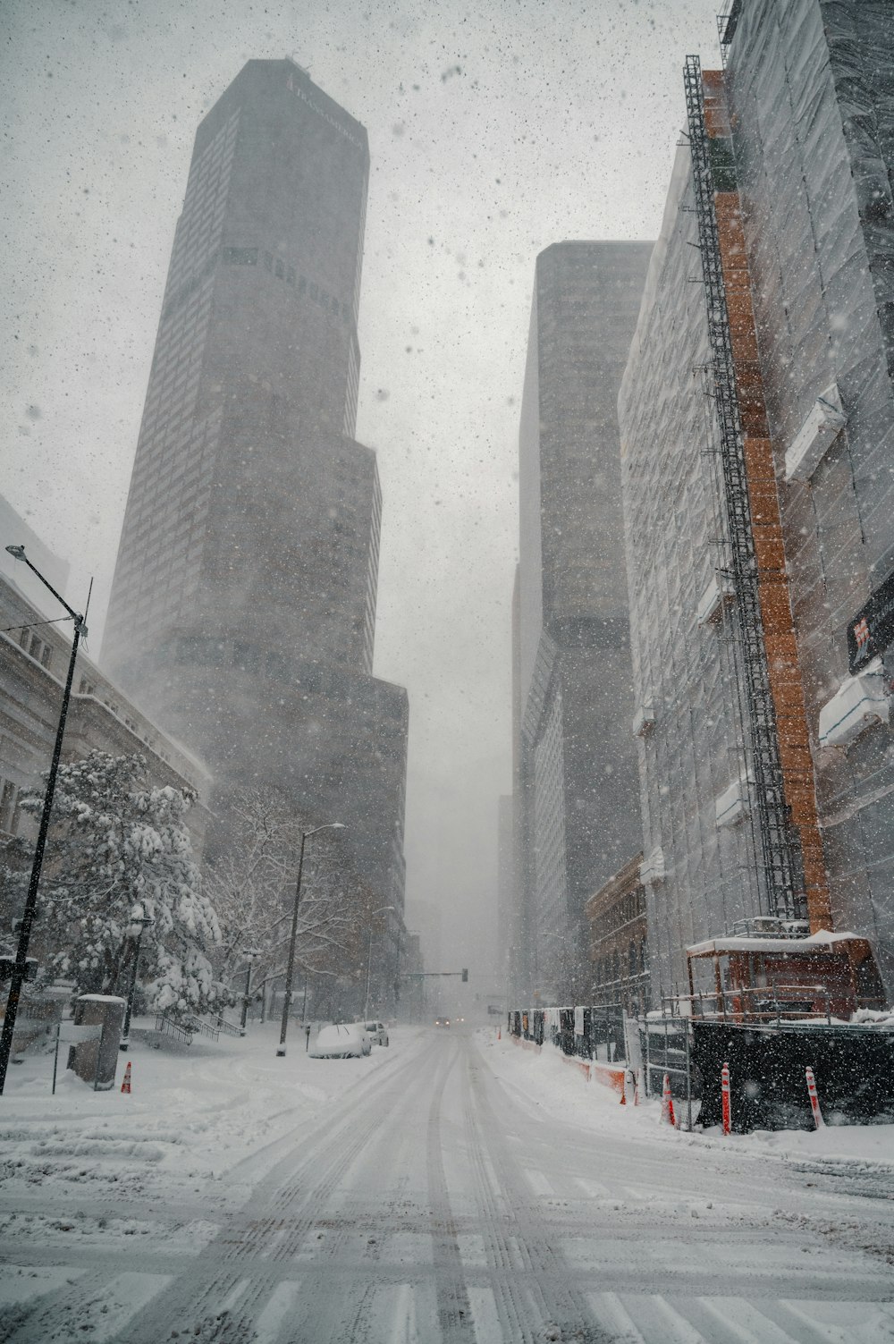 snow covered road near building during daytime