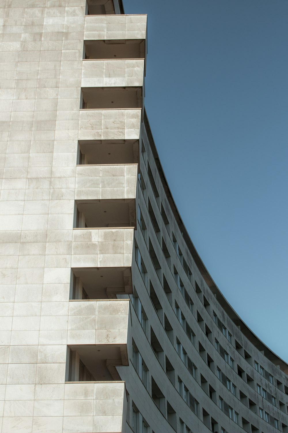 brown concrete building under blue sky during daytime