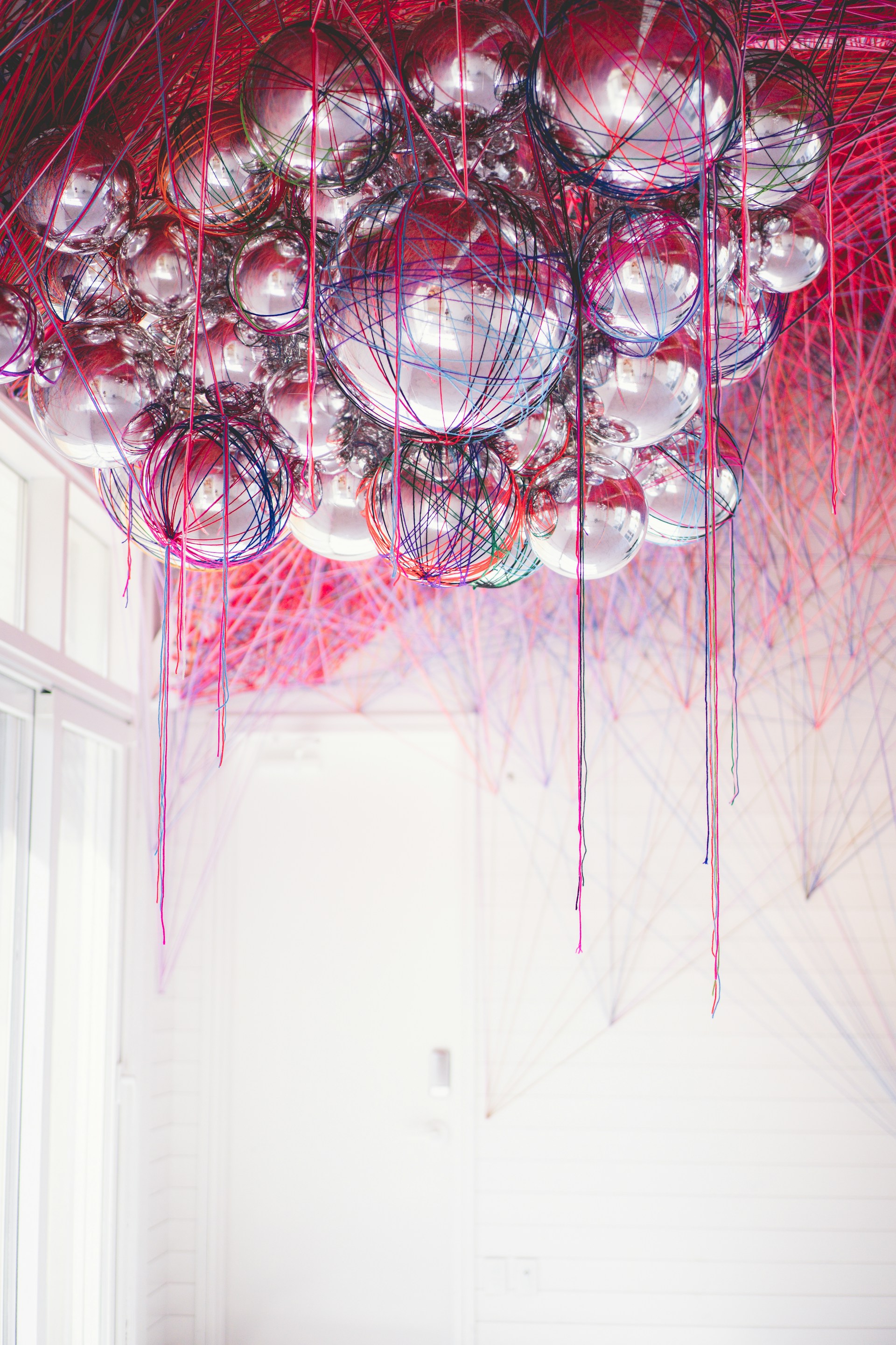 clear glass chandelier turned on in room