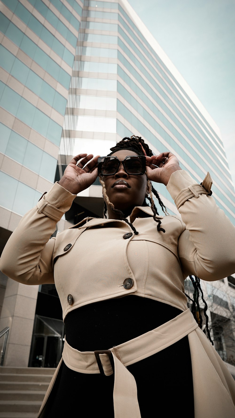 man in brown button up jacket wearing black sunglasses