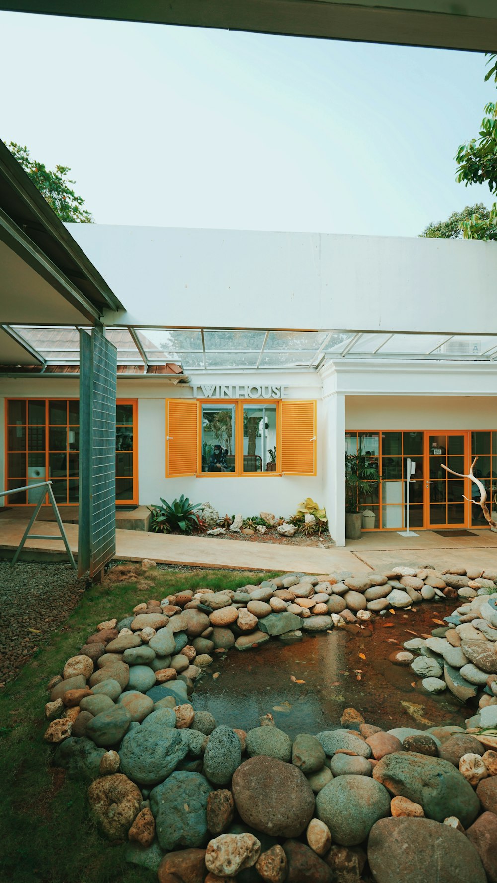 white concrete building with brown wooden door