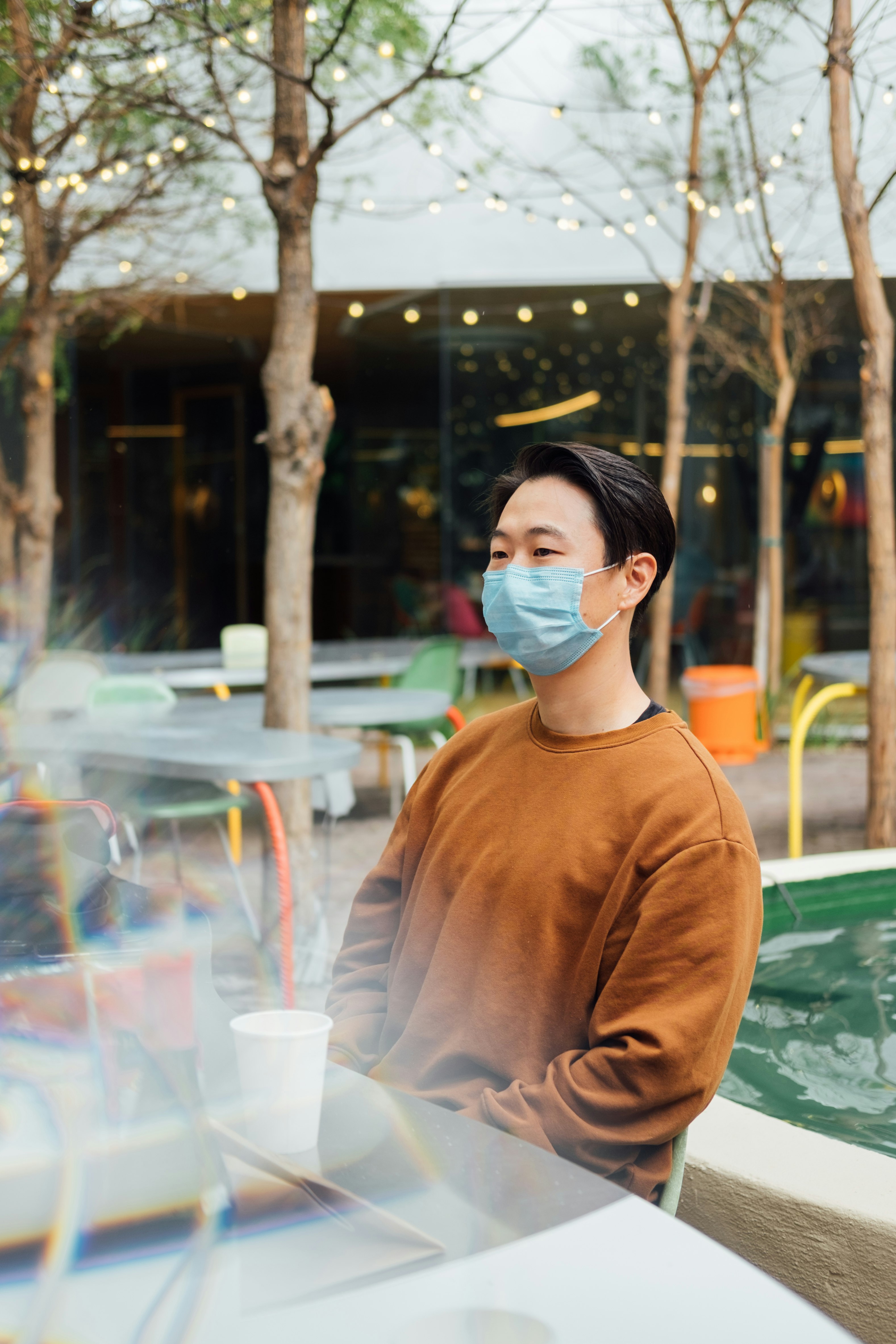 man in brown leather jacket wearing white mask and white mask