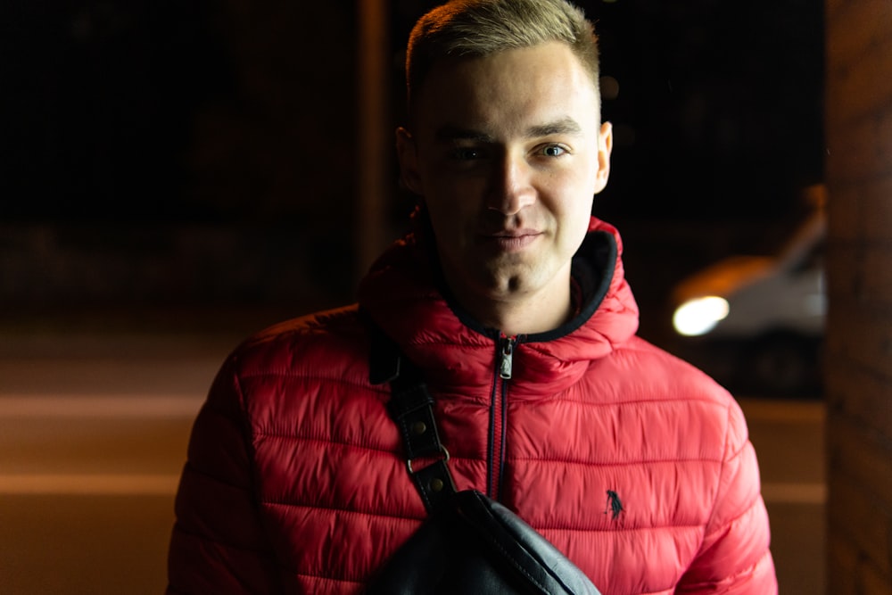 man in red bubble jacket