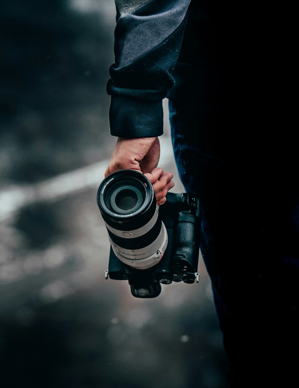 person holding black and white camera