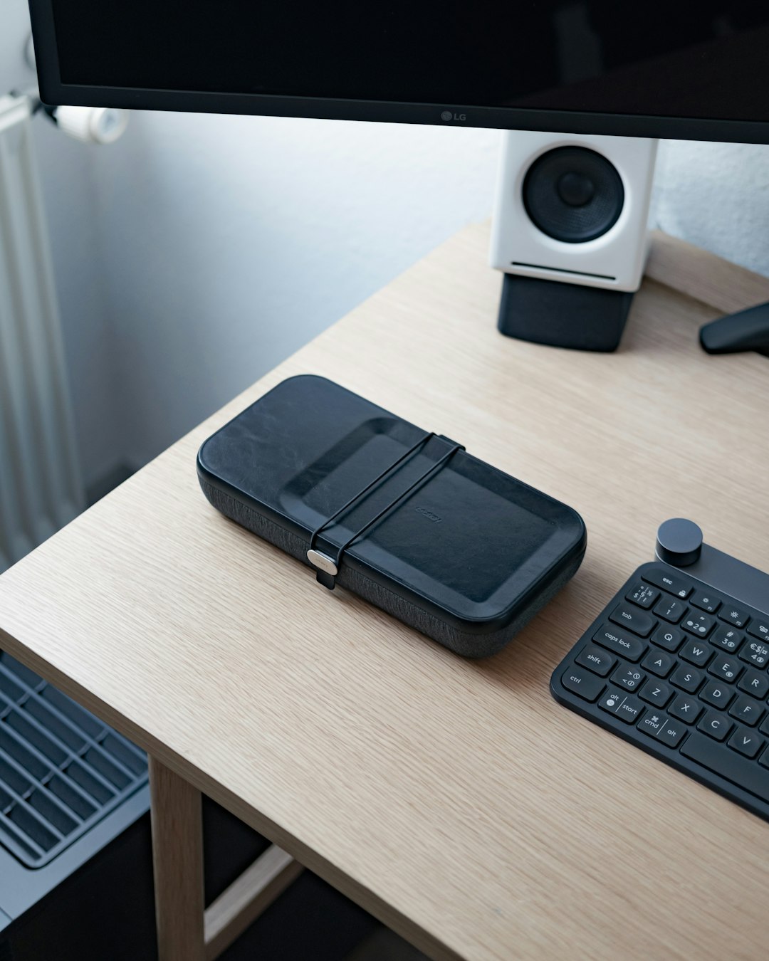 black tablet computer keyboard on brown wooden desk