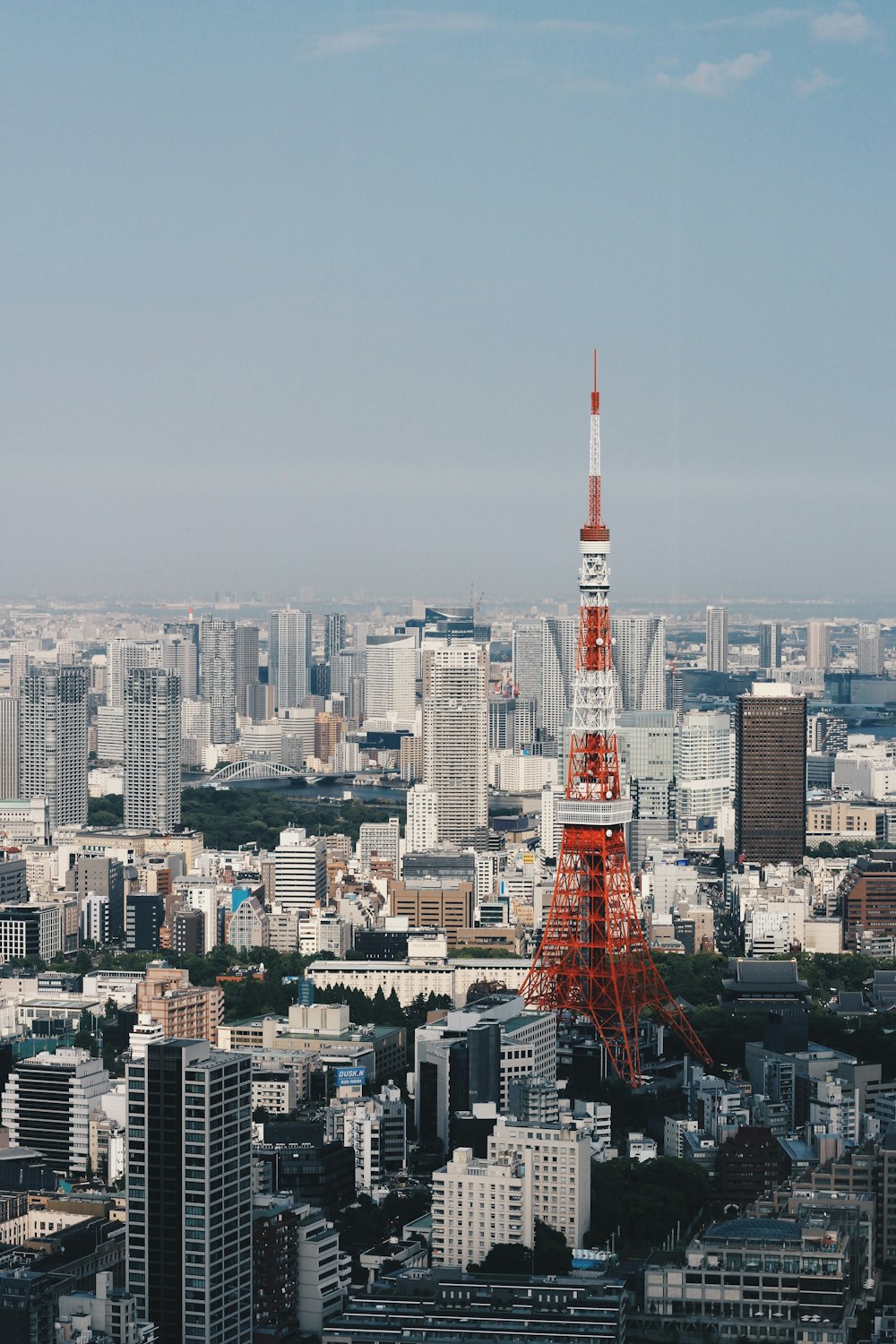 red and white tower in the city during daytime