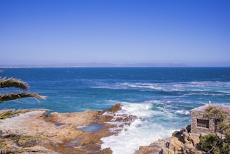 person surfing on sea waves during daytime