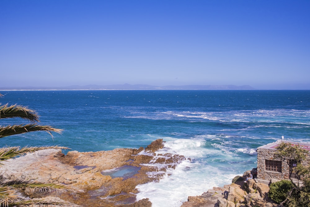 person surfing on sea waves during daytime