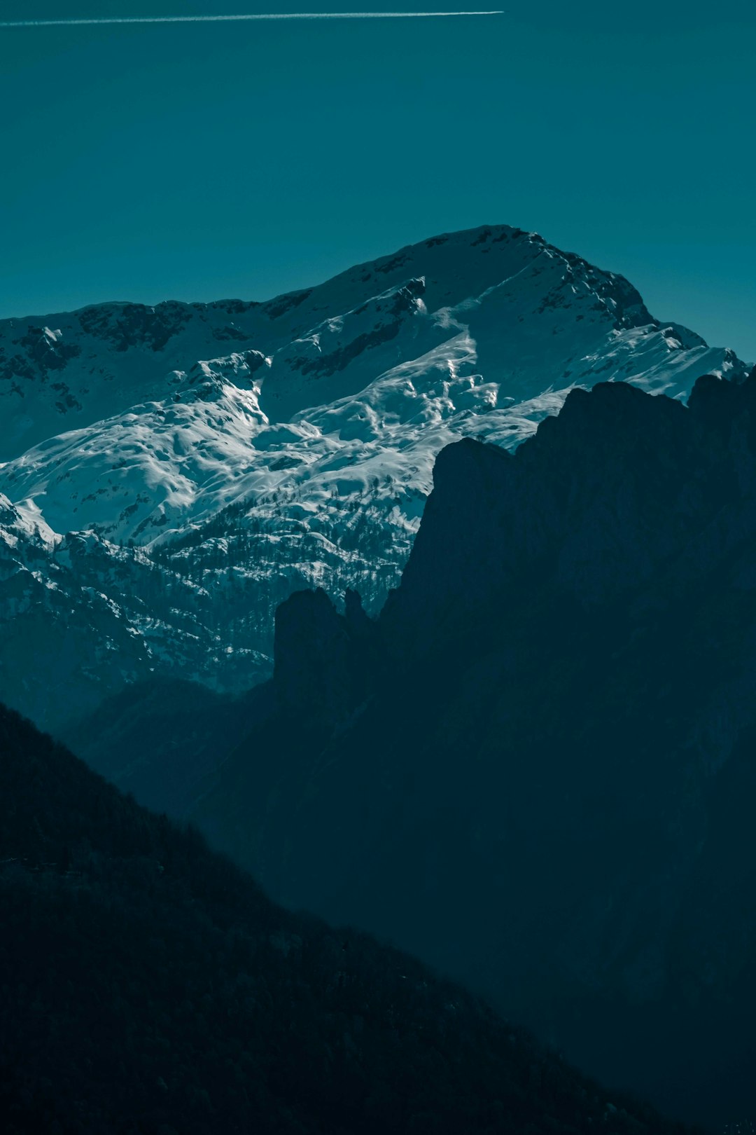 snow covered mountain during daytime