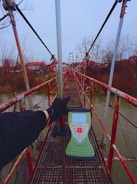 Engineers surveying a bridge construction over a river in Scotland.