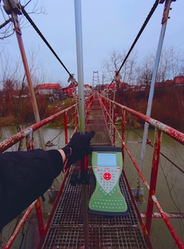 Engineers surveying a bridge construction over a river in Scotland.