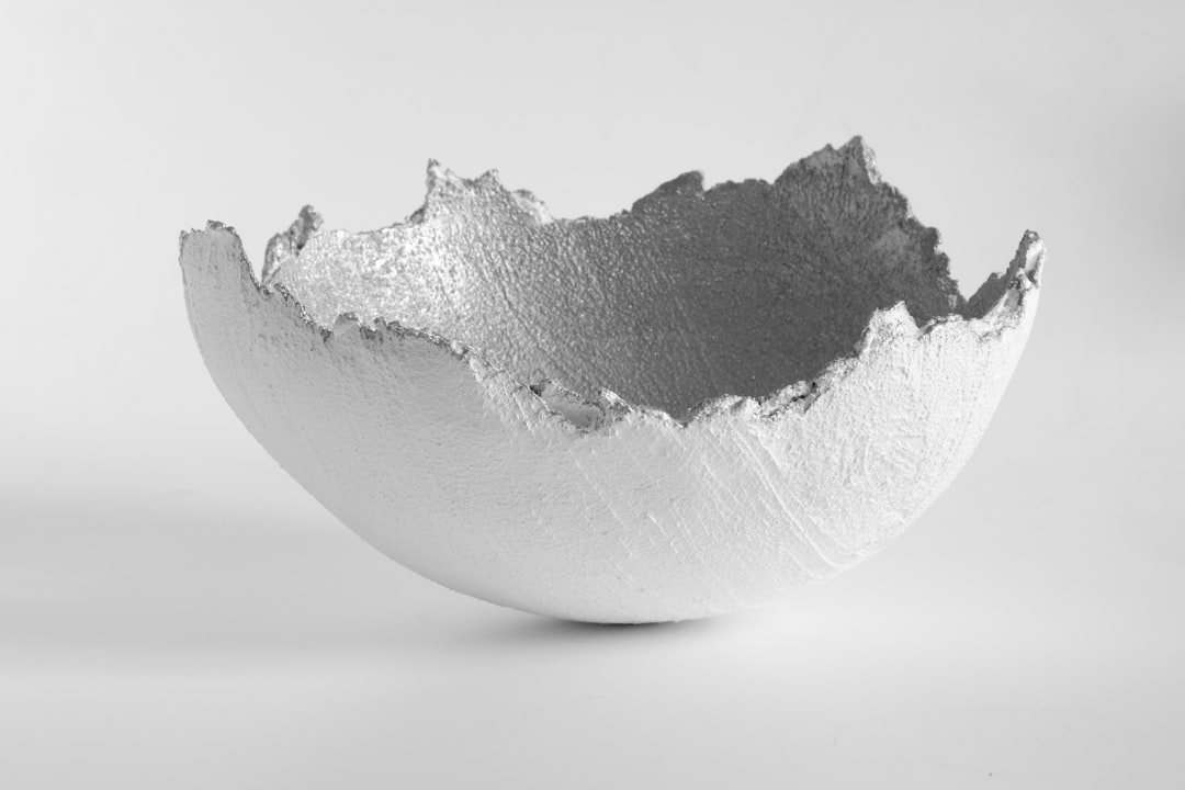 white and gray stone on white surface, The egg is broken. Italy will experience Easter in lockdown again this year!