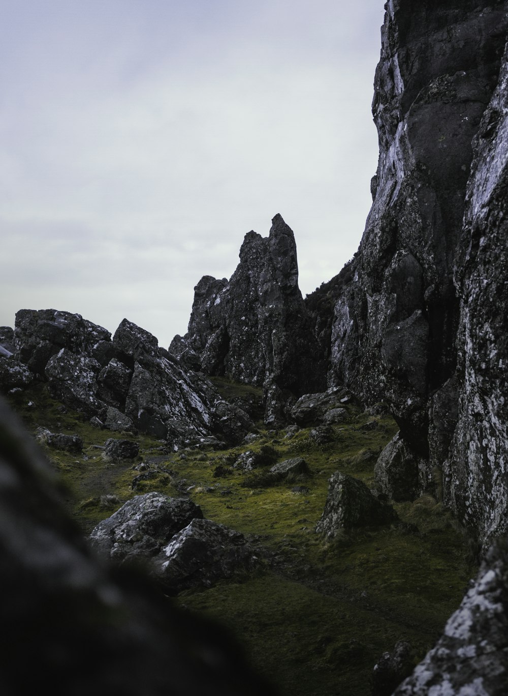 gray rocky mountain under white sky during daytime