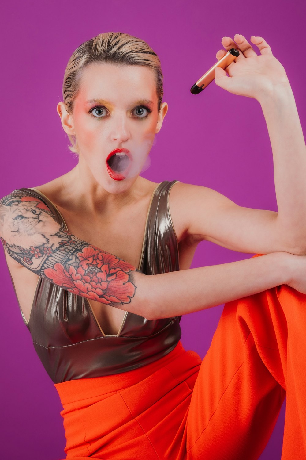 woman in red dress holding microphone