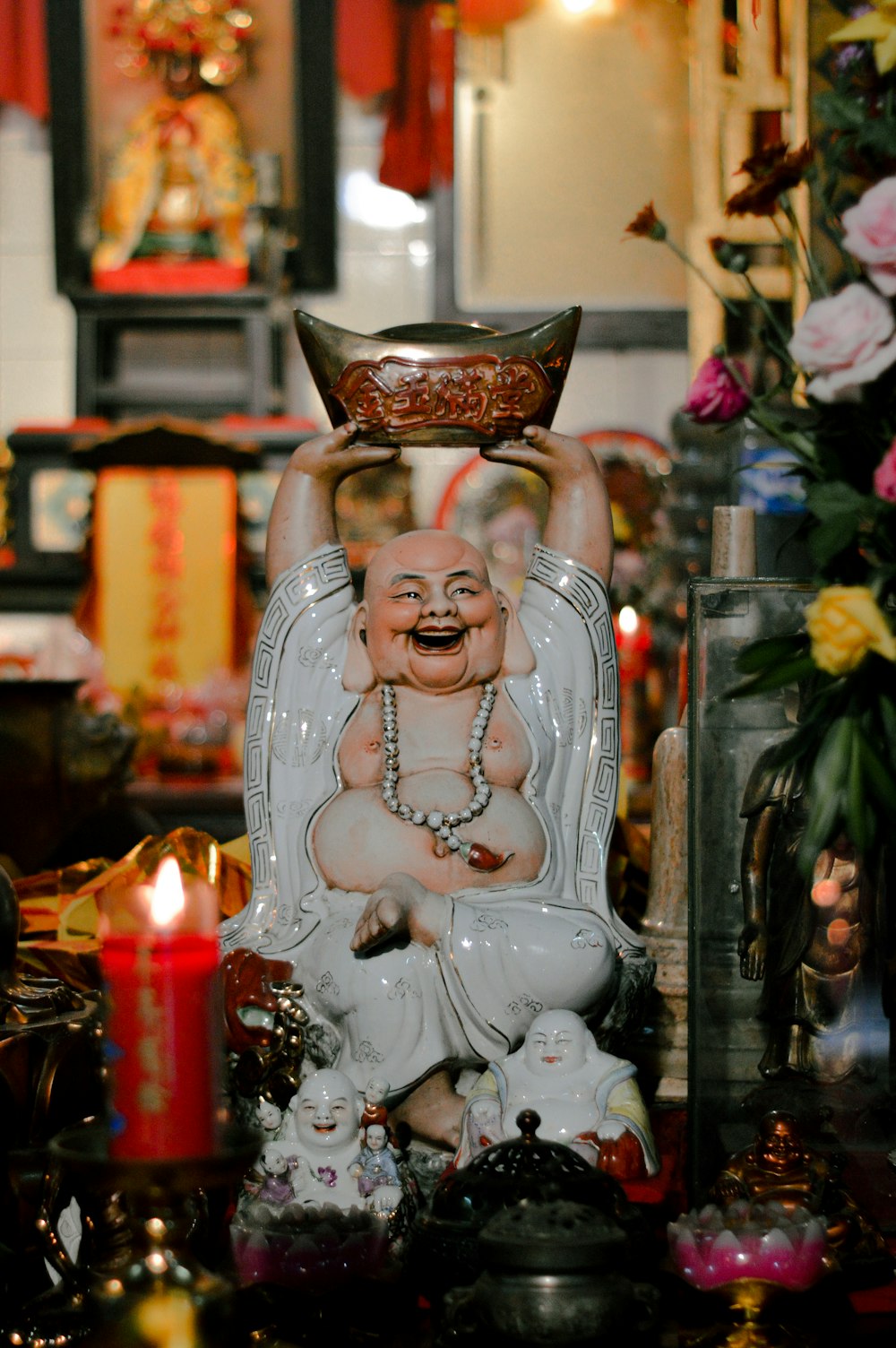 white ceramic angel figurine on brown wooden shelf