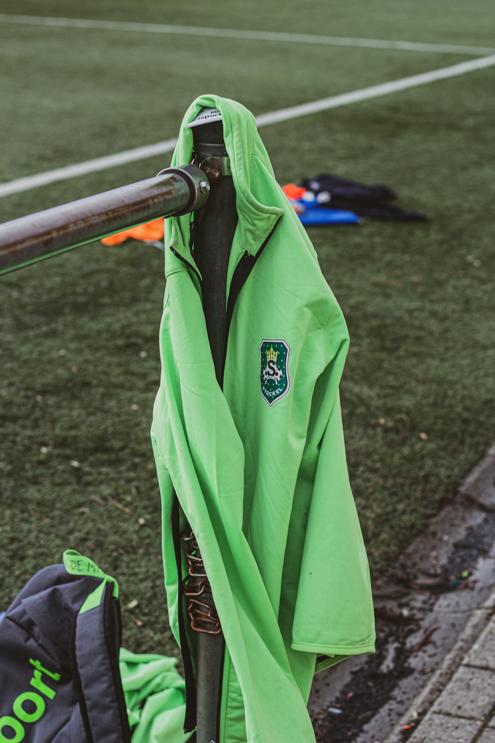 green and black zip up jacket