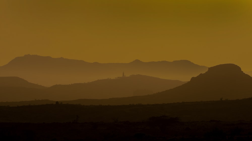 silhouette of mountains during daytime