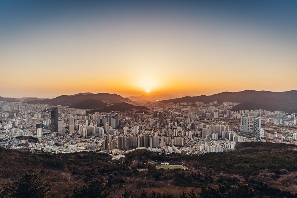 city skyline during orange sunset