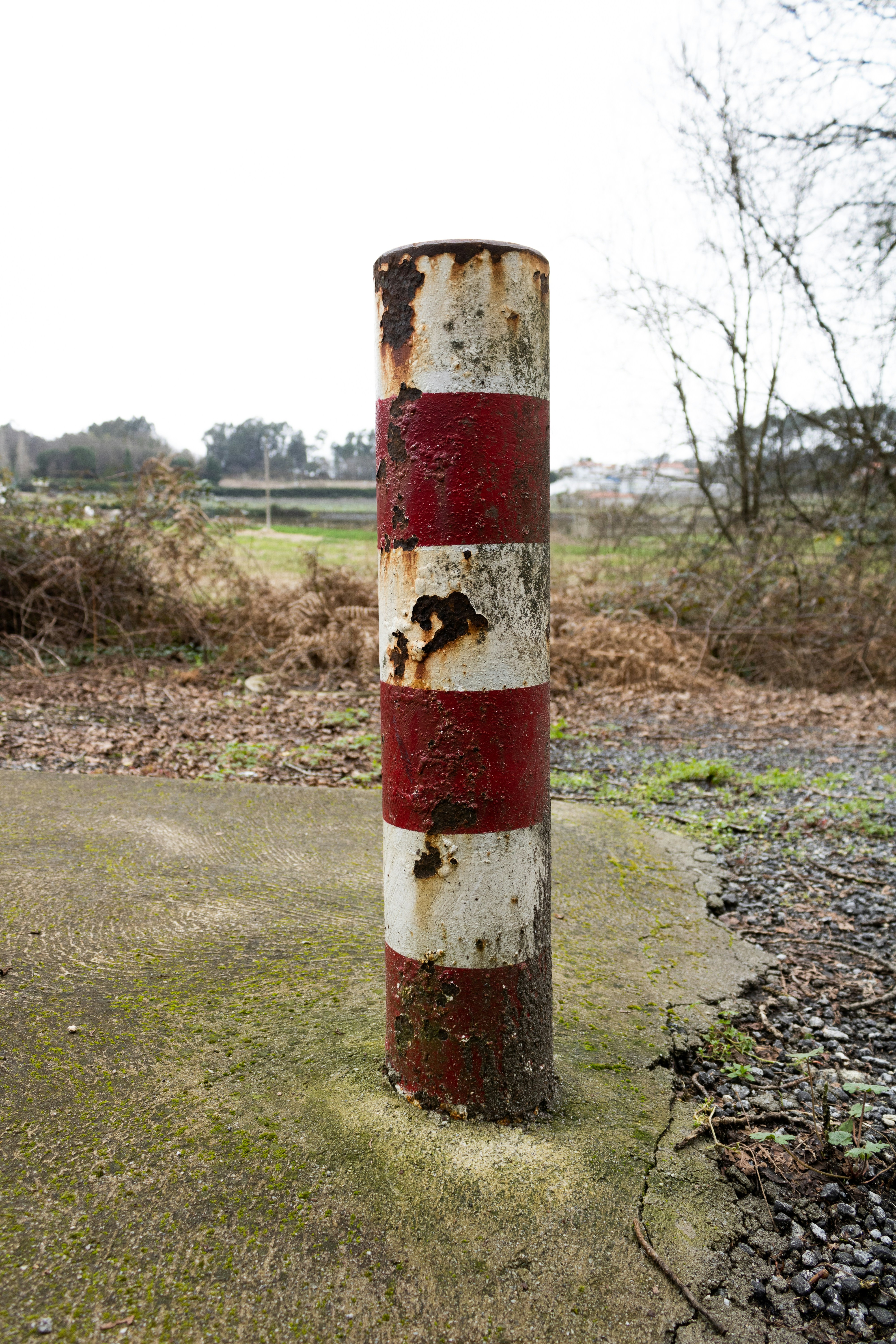 red and white metal post