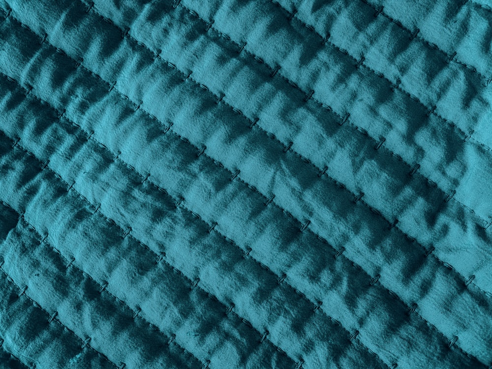blue and black knit textile