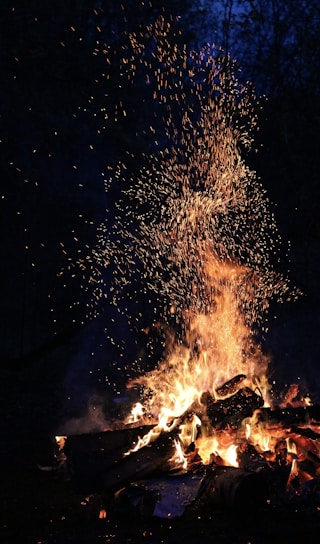 bonfire under starry night sky