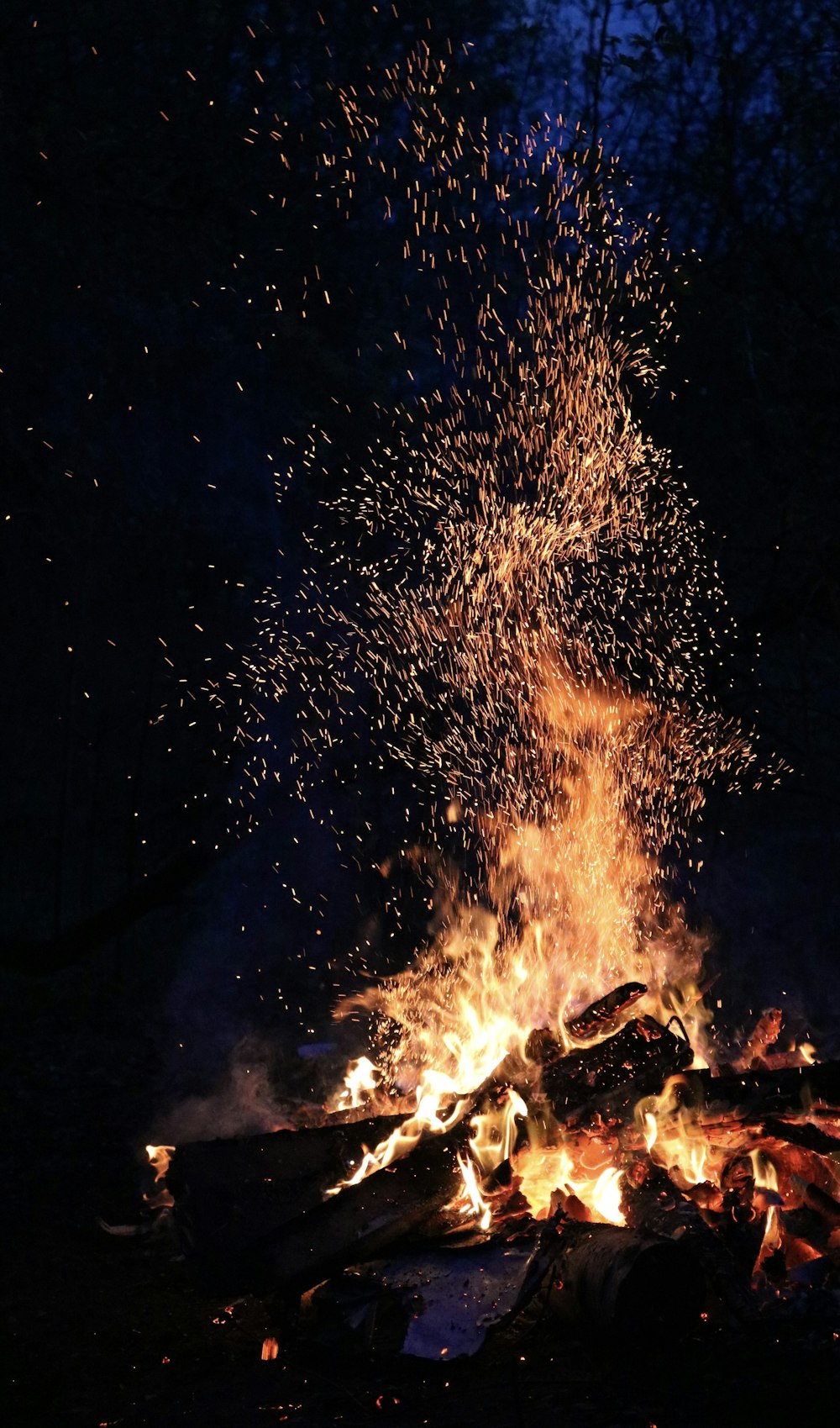 bonfire under starry night sky