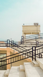Custom steel railing with geometric patterns on a commercial building staircase