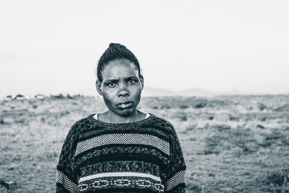 grayscale photo of woman in sweater