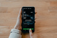 person holding black samsung android smartphone