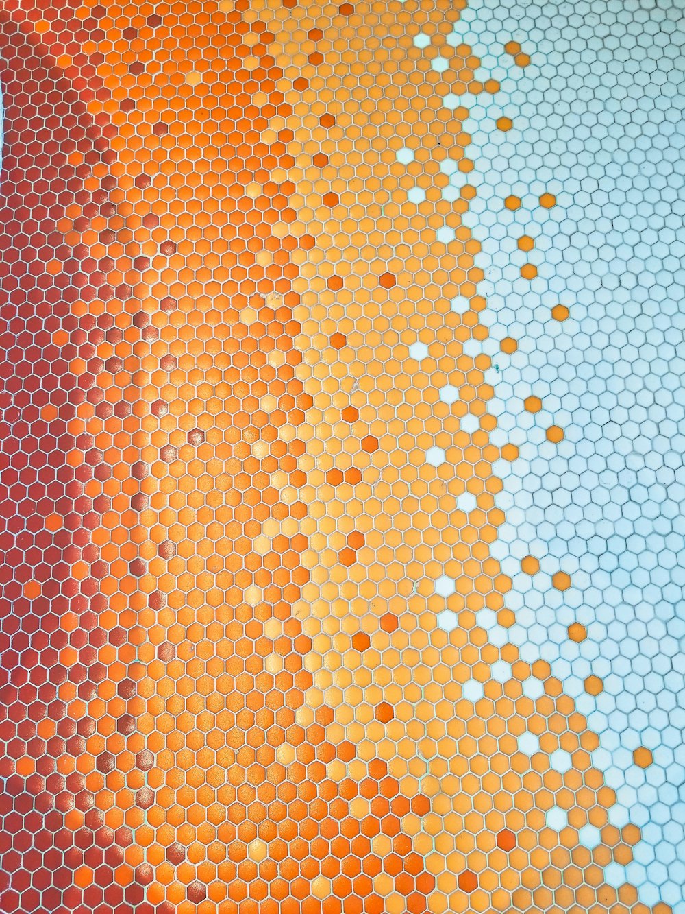 orange and white polka dot textile