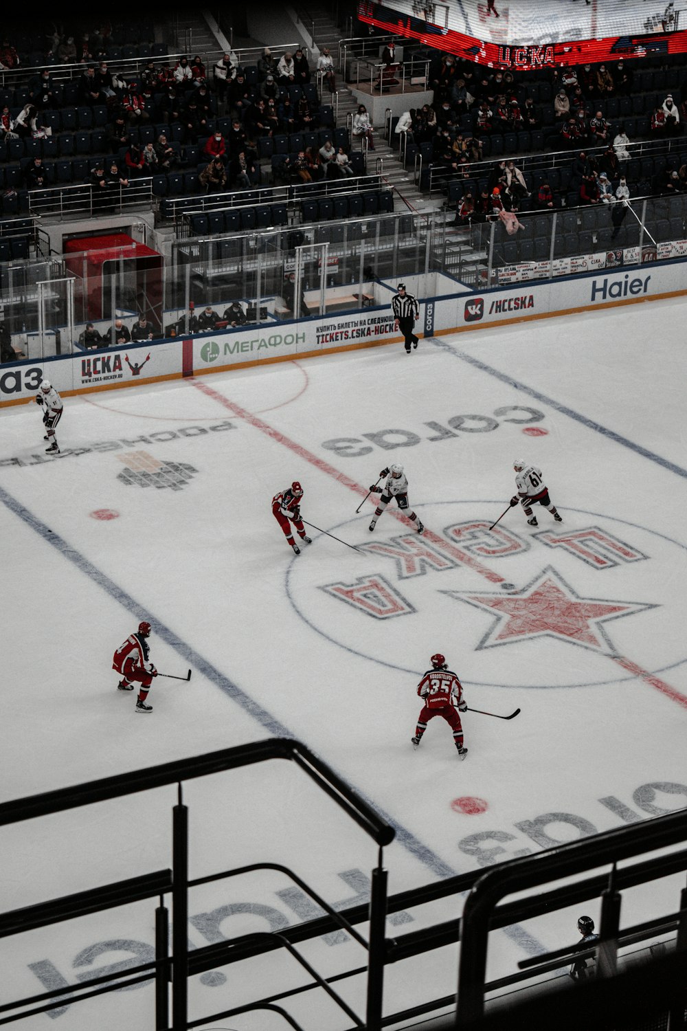 people playing ice hockey on ice hockey field