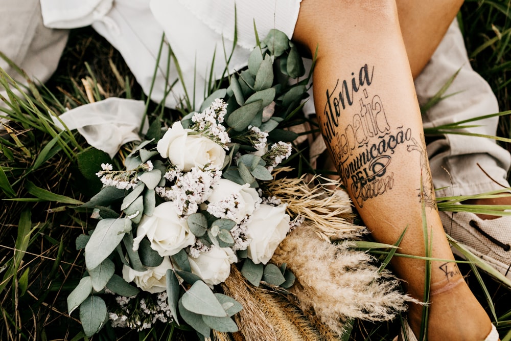 white flowers on persons leg