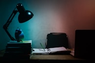 A mock test setup with a timer and study resources on a desk.