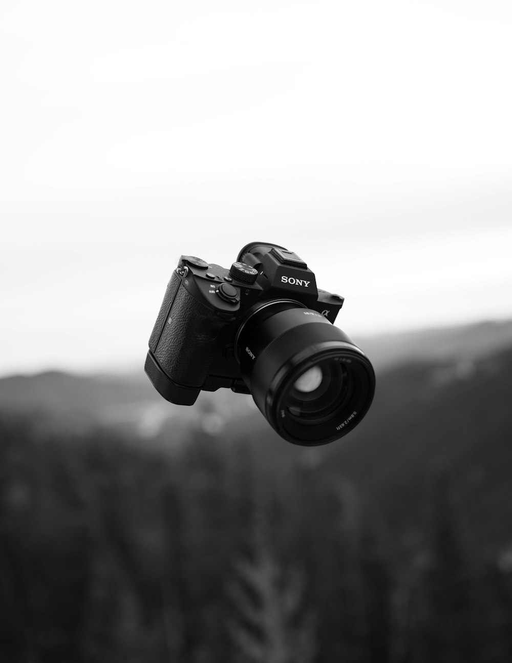 grayscale photo of dslr camera