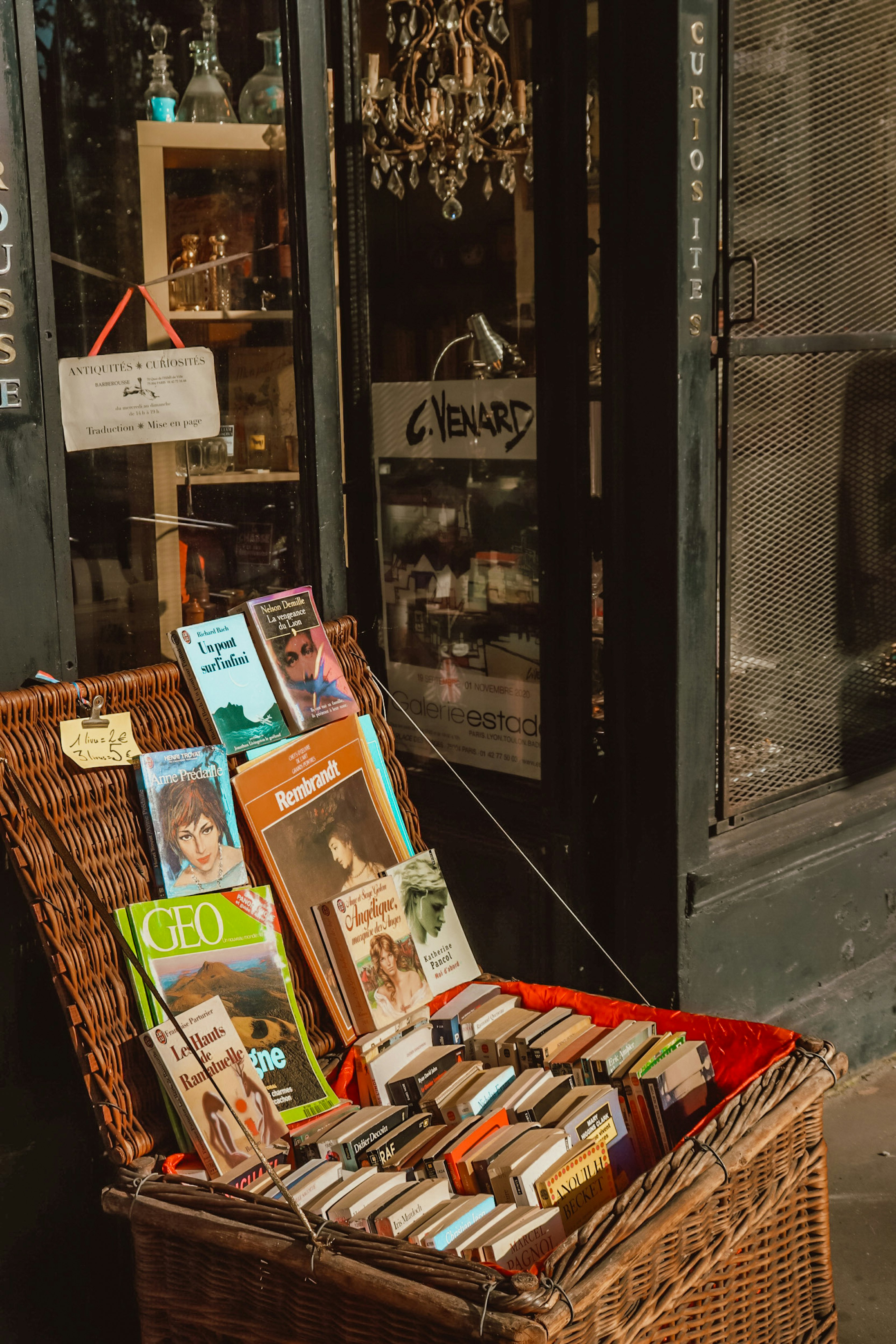 magazines on brown woven basket