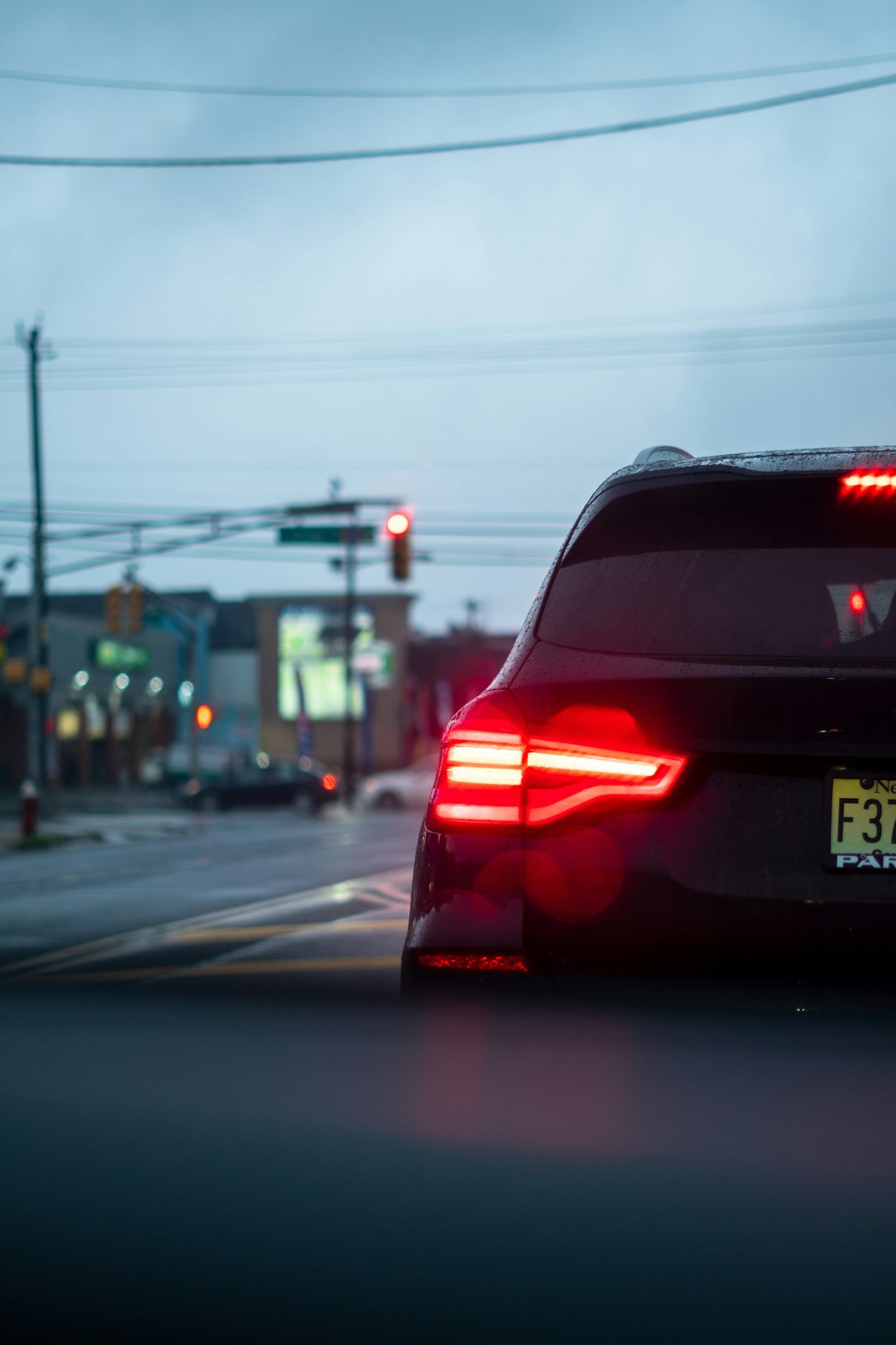 red car on road during night time