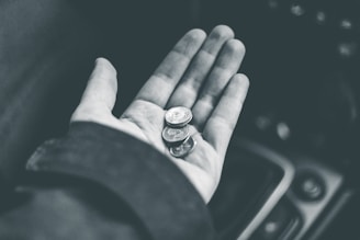 grayscale photo of person wearing ring