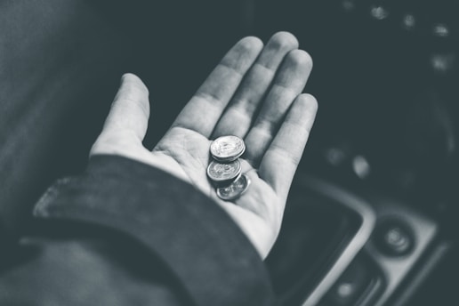 grayscale photo of person wearing ring